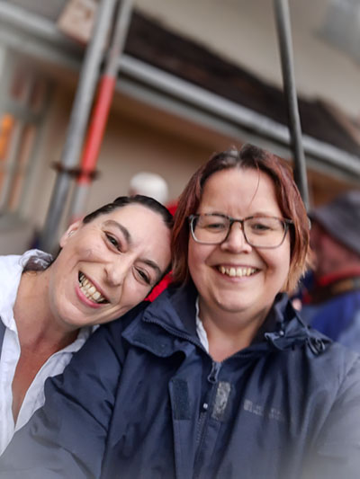 2 of Nancy Butterfly dancers smiling for the camera