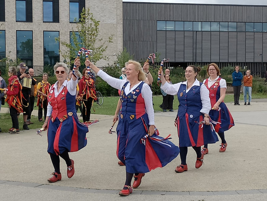 Set of Nancy Butterfly dancing outdoors in Selly Oak Birmingham in front of new buildings