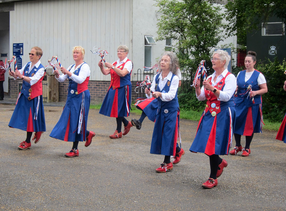 dancing on a damp day amongst historic buildings