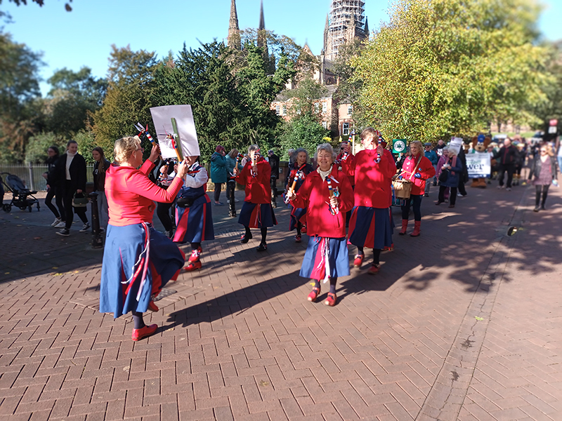 dancing in the procession with the cathedral prominent in the background