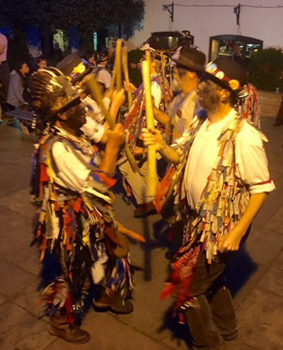 Alvechurch Morris dancers in action with sticks at the ready