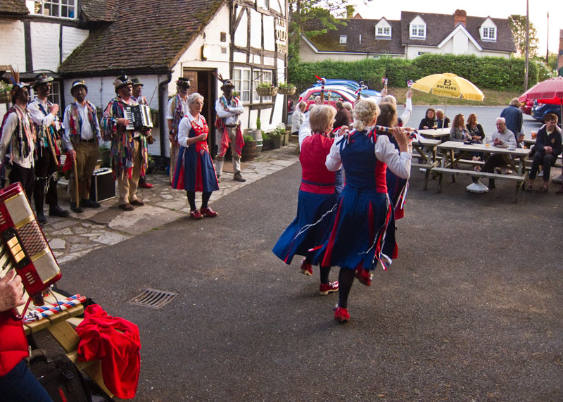 Dancing in front of the timber framed Old Bull, home of the 'Archers'