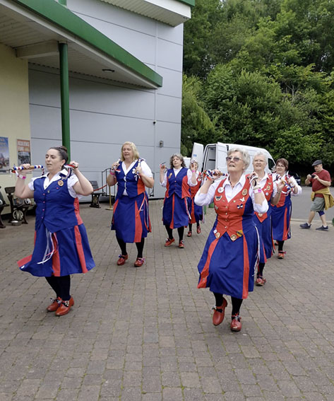8 dancers performing a set in front of the engine sheds in Highley